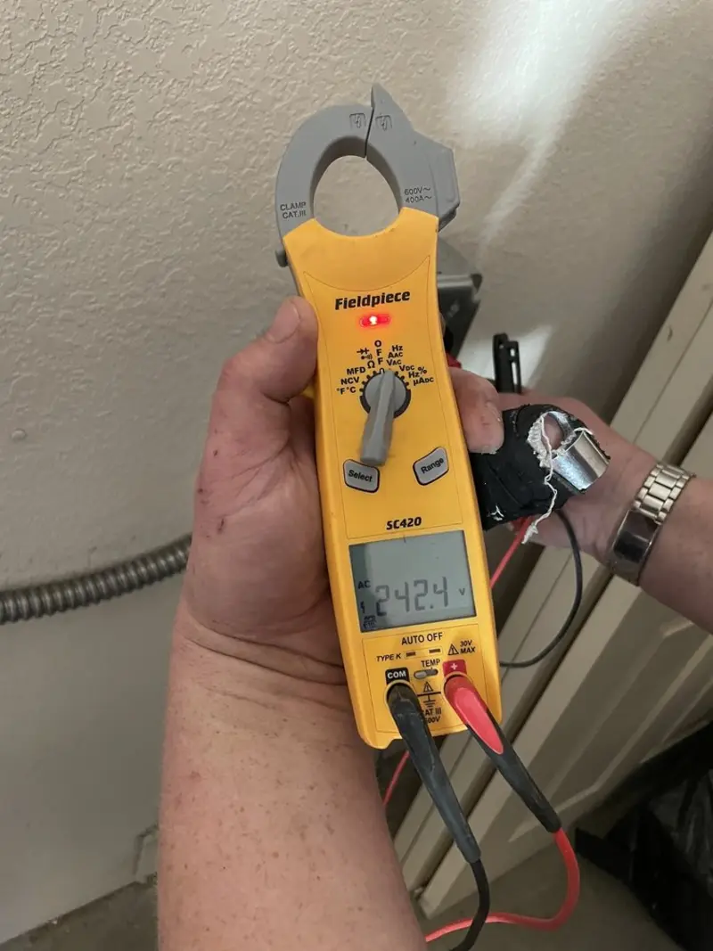 Voltage testing with clamp meter during Ceiling Fan Installation in Buckhannon